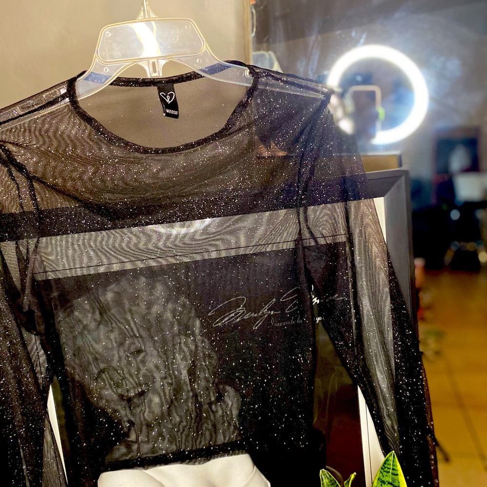 Black long sleeve glitter mesh top.